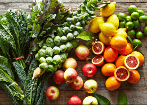 a group of fruits and vegetables on a wood surface Healthy Weight Loss Diets Burgess Hill